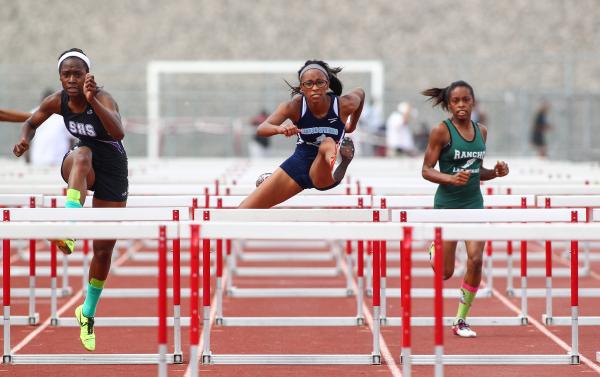 Canyon Springs’ Courtney Robinson take the lead in the Sunrise Region girls 100-meter ...