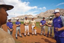 Sunrise Mountain High School varsity baseball head coach Shawn Dickson, right, speaks to his ...