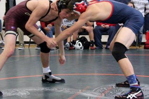 Faith Lutheran 145-pound freshman Tucker Prince ties up with Liberty junior Storm Roper, who ...