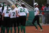 Palo Verde’s Brooke Stover approaches home plate and her teammates after hitting the g ...