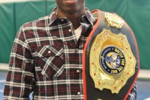 Spring Valley High School senior Ray Waters poses with one of his trophy belts in the wrestl ...
