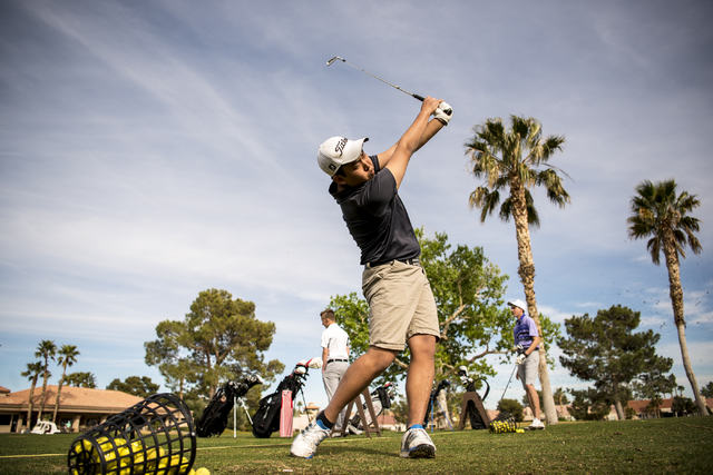 Desert Oasis golf team member Syouta Wakisaka swings during practice at Palm Valley Golf Cou ...