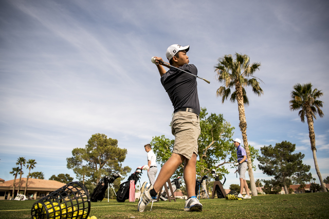 Desert Oasis golf team member Syouta Wakisaka swings during practice at Palm Valley Golf Cou ...