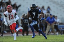 Desert Pines running back Isaiah Morris scores a touchdown on the opening drive of the game ...