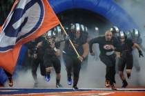 Bishop Gorman defensive lineman Haskell Garrett (16) and head coach Kenny Sanchez, right, le ...