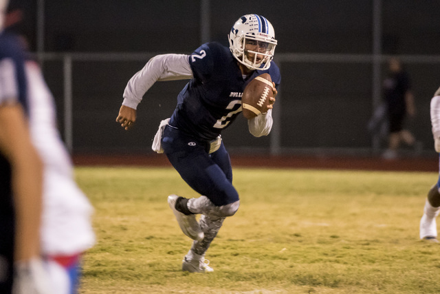 Centennial Bulldogs quarterback Jamaal Evans (2) runs with the ball against the Liberty Patr ...