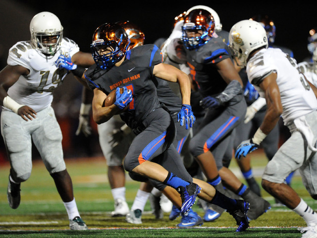 Bishop Gorman running back Biaggio Walsh (7) rushes the ball against Long Beach Poly in the ...