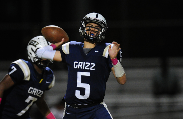 Spring Valley Grizzlies quarterback K.C. Moore (5) passes against Mojave in the third quarte ...