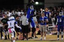 Green Valley Gators wide receiver Marquez Powell catches a pass for a first down against Bas ...