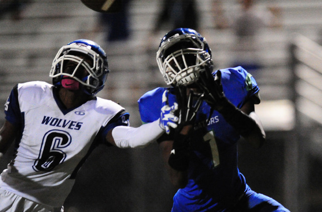 Green Valley Gators wide receiver Marquez Powell (1) catches a touchdown pass as Basic Wolve ...