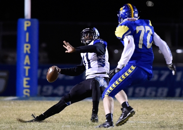 Desert Pines quarterback Marckell Grayson (11) looks to pass against Moapa Valley’s La ...