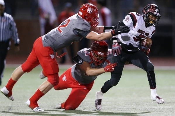 Desert Oasis Brannon Flowers (5) is tackled by Arbor View‘s defense in the Sunset Regi ...