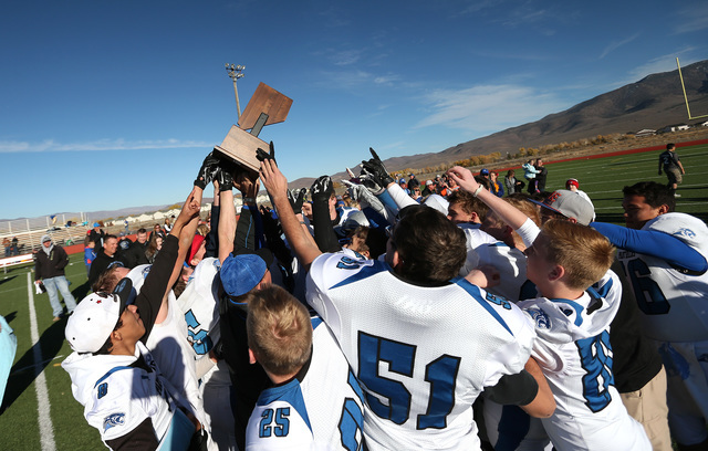 Pahranagat Valley celebrates after defeating Whittell 54-28 in the NIAA DIV championship gam ...