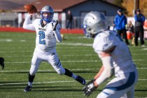 Pahranagat Valley’s Tabor Maxwell passes to Shawn Wadsworth for a touchdown during the ...