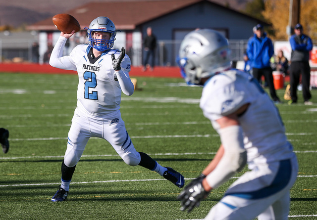 Pahranagat Valley’s Tabor Maxwell passes to Shawn Wadsworth for a touchdown during the ...