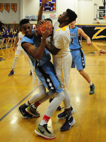 Centennial guard Troy Brown, left, fights for a rebound with Durango forward Zyare Ruffin in ...