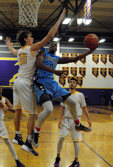 Centennial guard Troy Brown (0) scores a field goal against Durango forward Jason Landman (1 ...