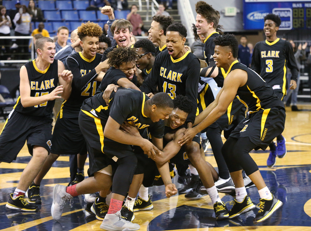 Clark celebrates their 43-39 over Desert Pines in the NIAA Division I-A state basketball cha ...