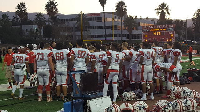 Liberty’s football team gathers on the sideline prior to Friday game against Centennia ...