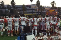 Liberty’s football team gathers on the sideline prior to Friday game against Centennia ...