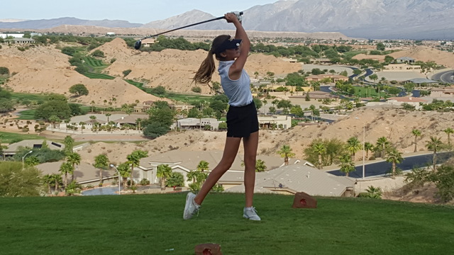 Madisan Walker of Boulder City hits her drive on the 16th hole during the Class 3A Southern ...