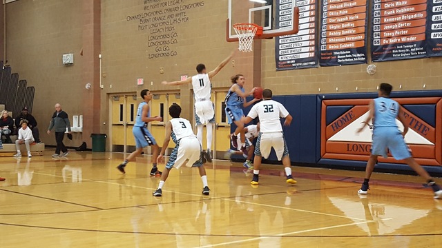 Centennial’s Hunter Bohls attempts a reverse layup in the second half of the Bulldogs& ...