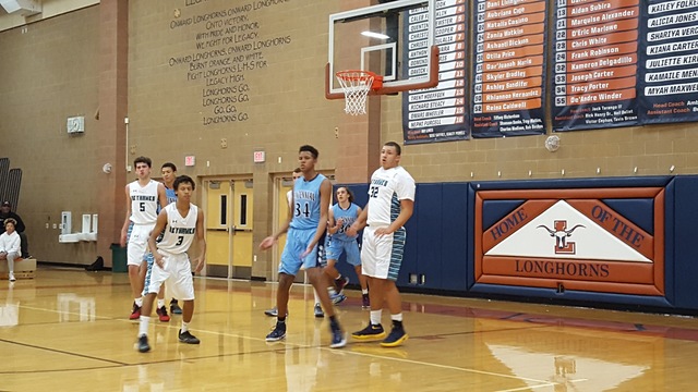 Centennial’s Orlando Robinson (34) and Devin Ross of Silverado (32) look on during the ...