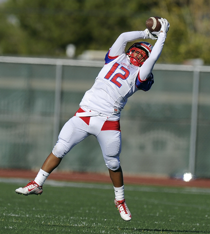 Liberty wide receiver Brad Viloria (12) catches a pass against Bishop Gorman in the the Divi ...