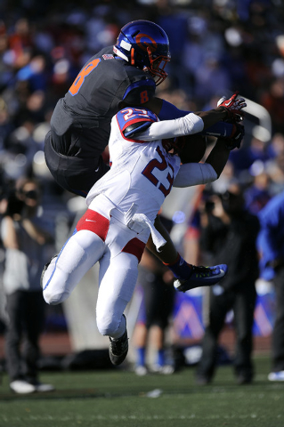 Liberty defensive back Curtis Washington breaks up a pass intended for Bishop Gorman tight e ...