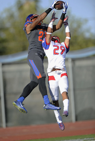 Liberty defensive back Jake Dedeaux (29) breaks up a pass intended for Bishop Gorman wide re ...