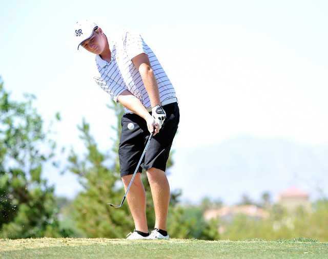 Shadow Ridge’s Benjamin Davis chips on the fourth hole during the final round of the S ...