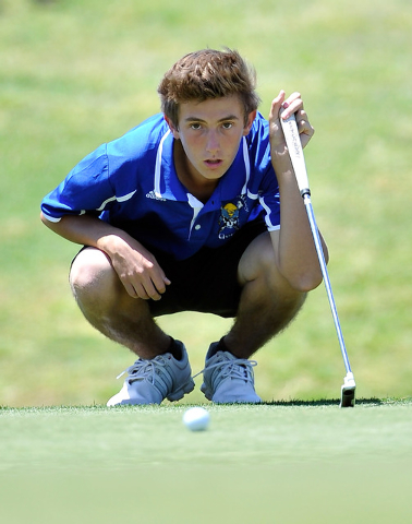 Moapa Valley’s Jacob Causey lines up his shot on the fifth hole during the final round ...