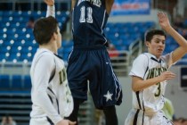 Agassi’s Deishuan Booker (11) shoots a jump shot against Incline’s Alex Zissis ( ...