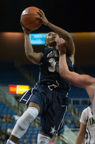 Agassi Prep’s Kenneth Katano (32) attempts a shot against Incline during the Division ...