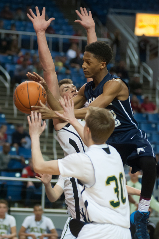 Agassi Prep’s Kobe Williams (12) tries to shoot between Incline’s Ben Snyder (55 ...