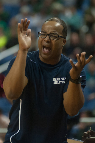 Agassi Prep coach Trevor Diggs cheers on his players during the Division III state final aga ...