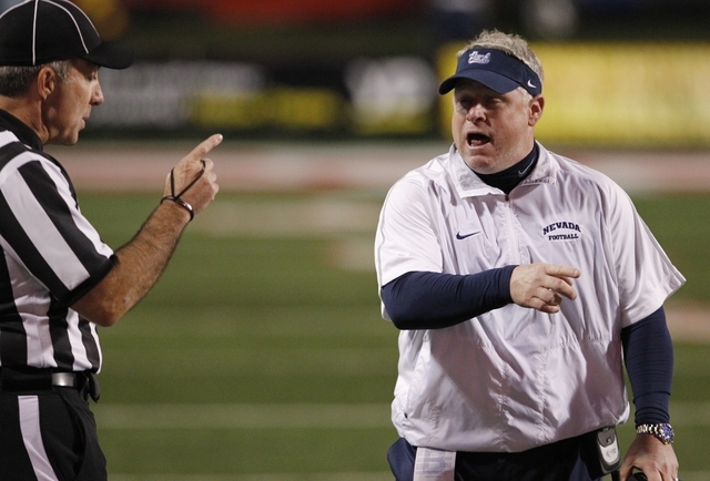 UNR coach Brian Polian speaks with an official during the second half of an NCAA college foo ...