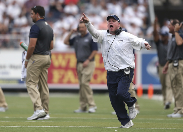 In this Saturday, Sept. 12, 2015, photo, Nevada coach Brian Polian yells to an official duri ...