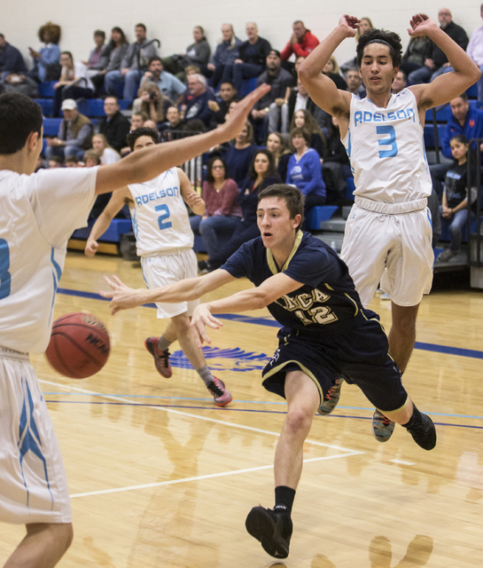 Lake Mead’s Sean Fuller (12) makes a pass in traffic past Adelson School’s Liddo ...