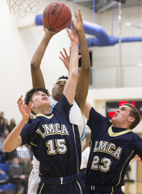 Adelson School’s Miles Hagan (30) fights for a rebound with Lake Mead’s Shay Rut ...