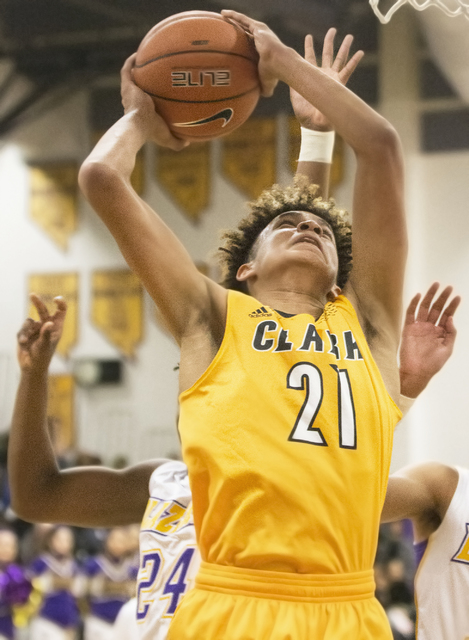 Clark’s Jalen Hill (21) grabs a rebound during the Chargers road matchup with the Dura ...