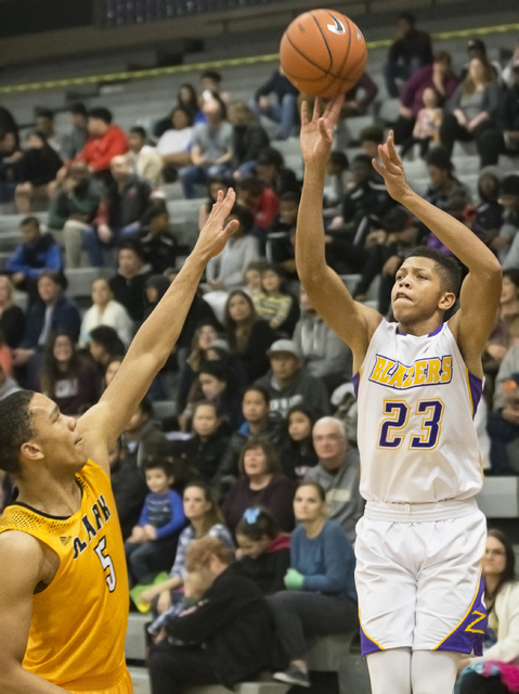 Durango’s Nicquel Blake (23) shoots a corner three over Clark’s Deshawn Wilson ( ...