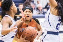 Legacy’s Taeha Pankey (3) is fouled by Shadow Ridge’s Summer Plunkett (20) while ...