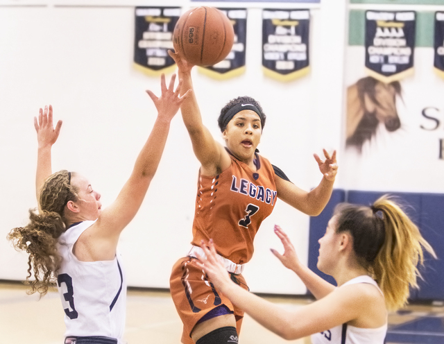 Legacy’s Taeha Pankey (3) makes a entry pass in traffic past Shadow Ridge’s Cait ...