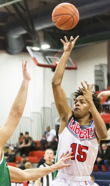 Liberty’s Cameron Burist (15) shoots a jump shot over Green Valley’s Canyon Lewi ...