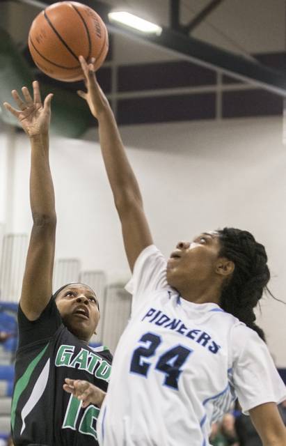 Green Valley’s Jamaica Lewis (12) gets her shot blocked by Canyon Springs’ Dayon ...