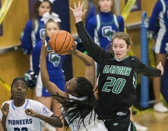 Green Valley’s Brooke Haney (20) leaps to block the shot of Canyon Springs’ Ke&# ...