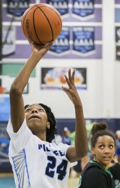 Canyon Springs’ Dayonna Maddox (24) converts a fast break layup past Green Valley&#821 ...