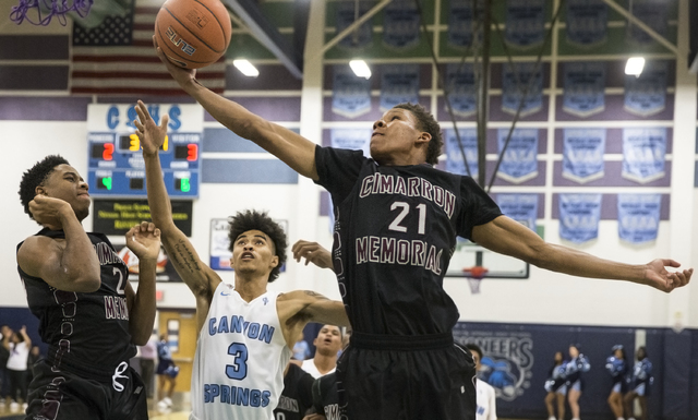 Cimarron-Memorial’s Karion Harrell (21) grabs a rebound on Monday, Nov. 28, 2016, at C ...