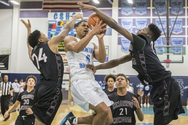 Canyon Springs’ Kevin Legardy (4) drives past Cimarron-Memorial’s Brian Washingt ...